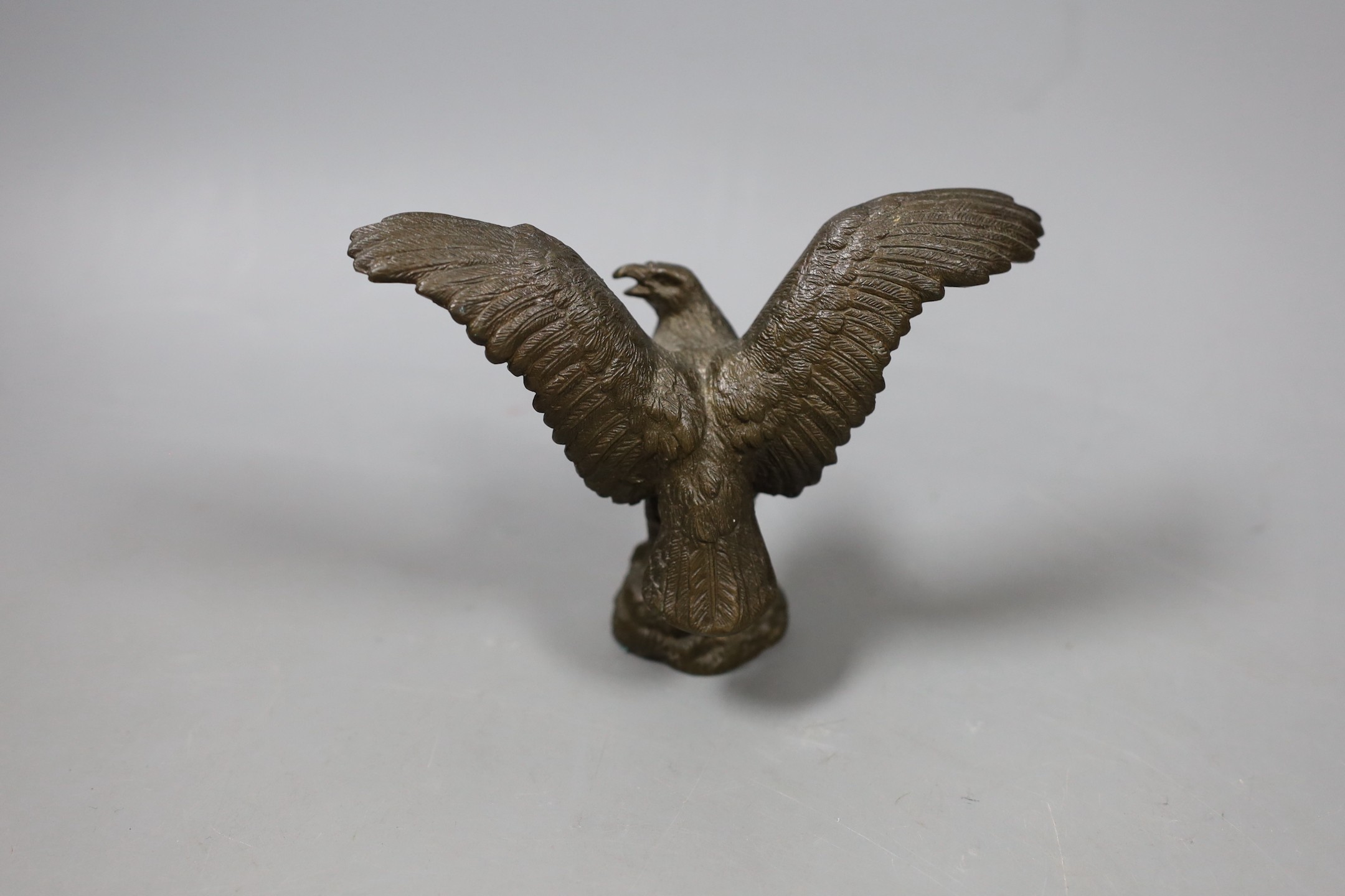A bronze figure of an eagle with wings spread, 10cm high